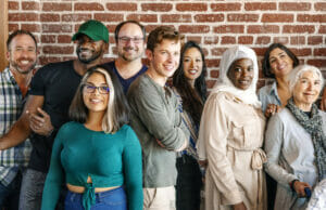 Diverse Group of people smiling and standing together