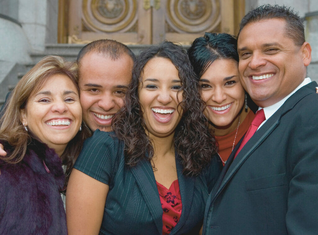 Smiling group of five professionals.