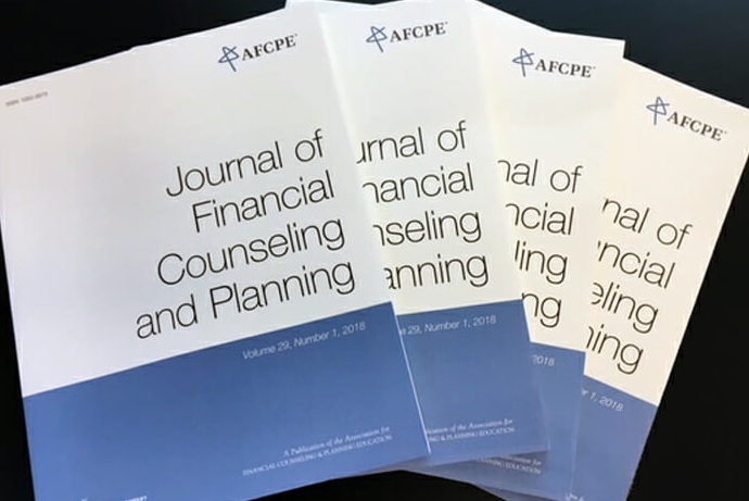 blue and white copies of the Journal of Financial Counseling and Planning