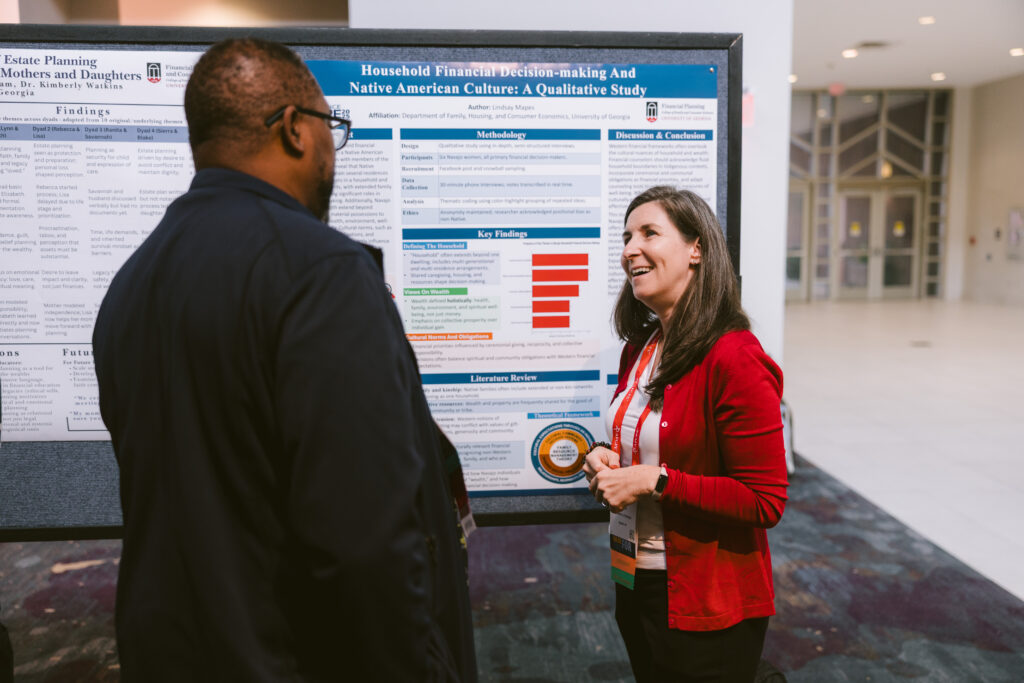 White woman and man of color having a friendly conversation about research and data