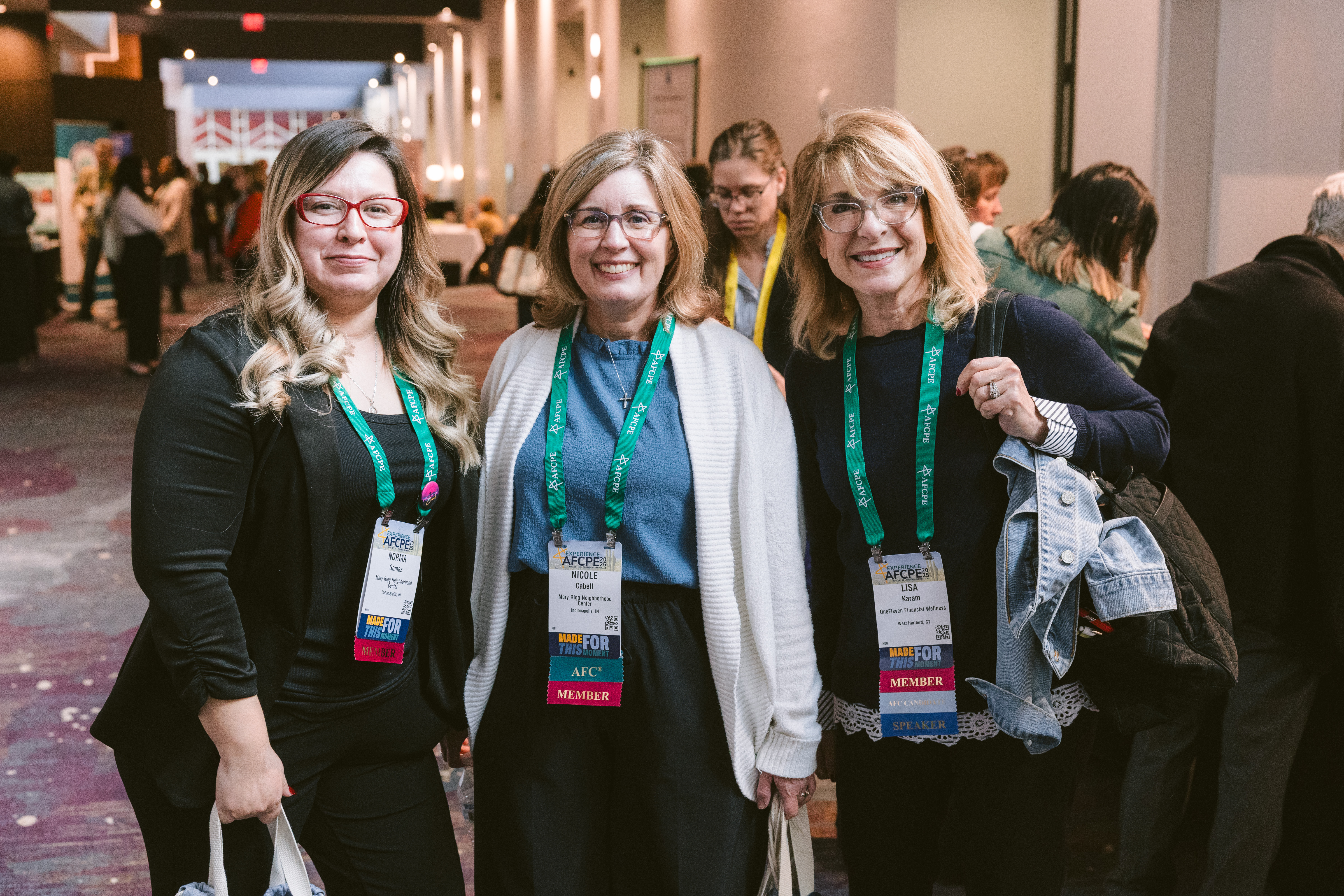 three women who are AFCPE members smiling at Symposium