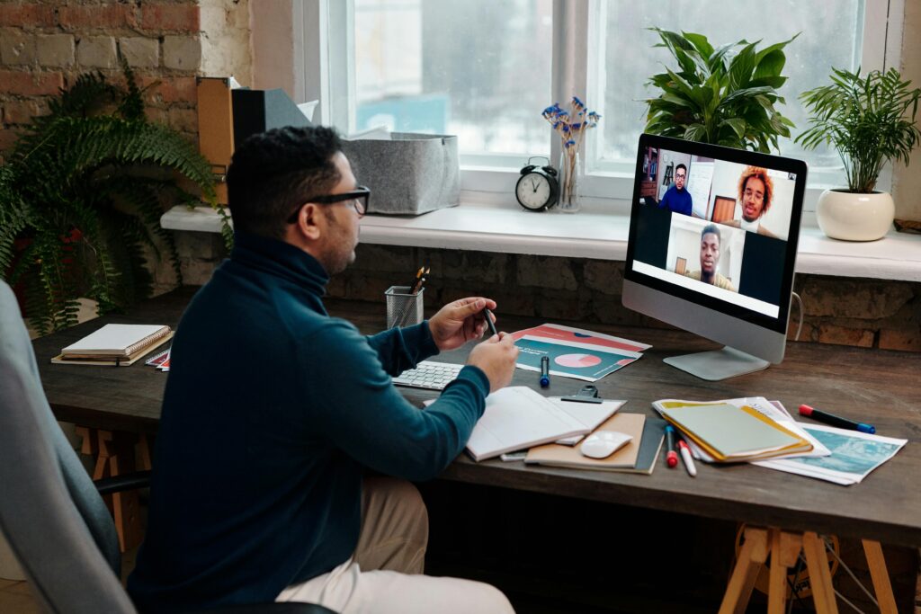 Man of color in a virtual meeting in his office