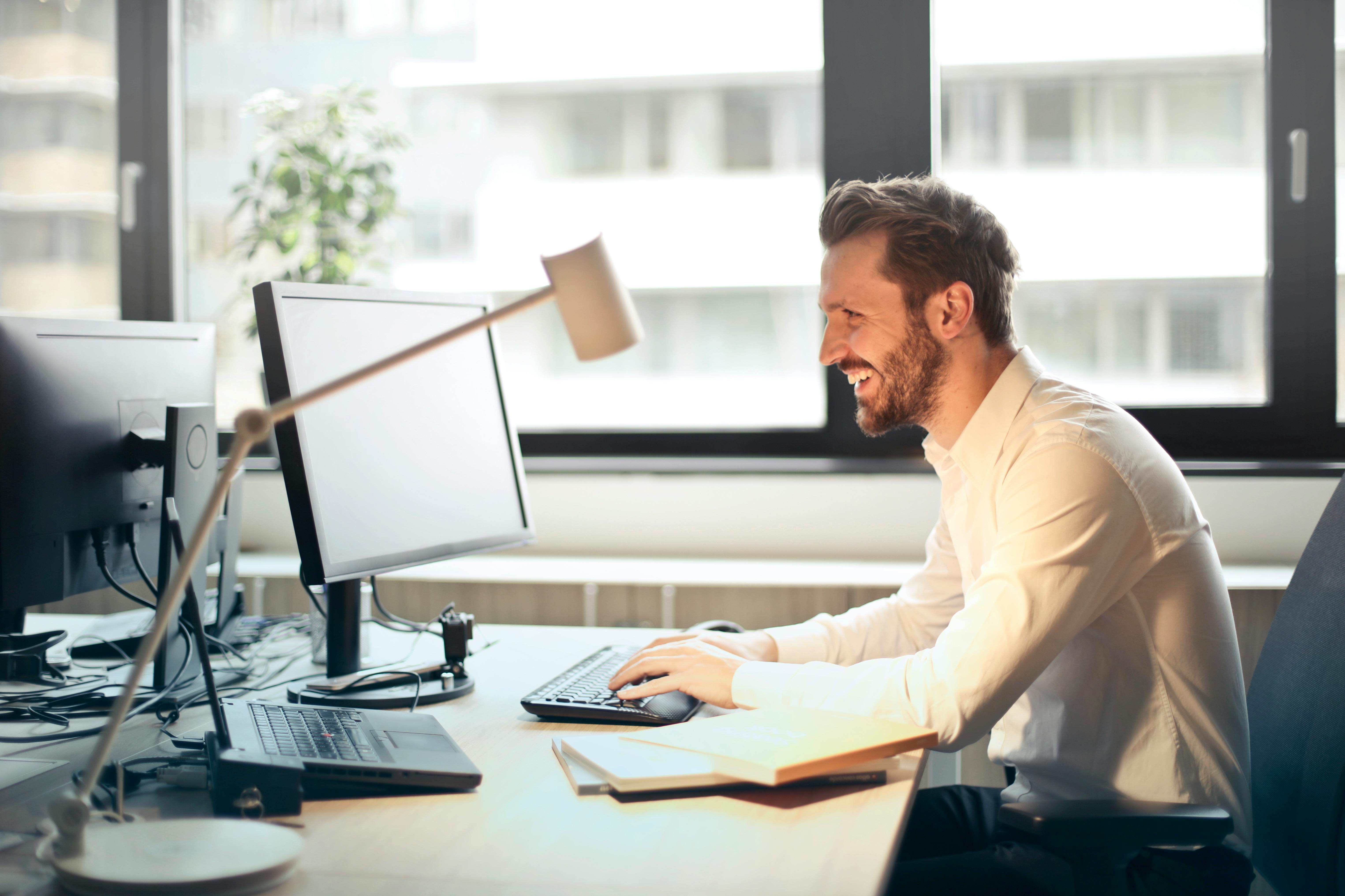 Man in his office working on laptop