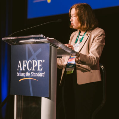 Dr. Barbara O'Neill announcing the recipient of the Mary O'Neill mini grant at Symposium