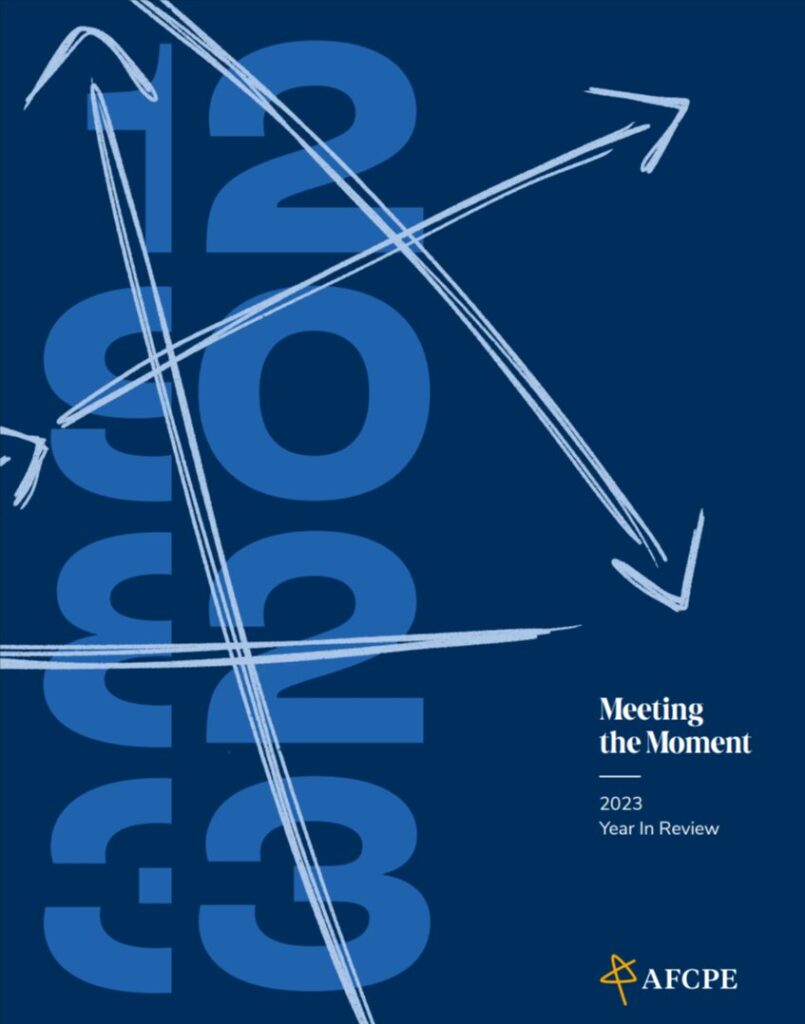 2023 in light blue with green arrows on the dark blue cover