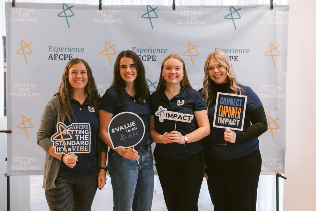4 college aged girls smiling for a picture