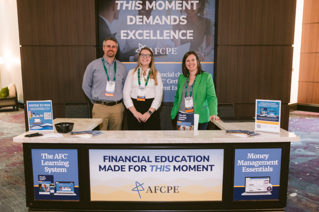 Three people standing in front of a podium.