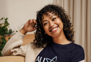 Photo of a woman wearing an AFCPE shirt.