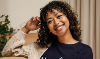 Photo of a woman wearing an AFCPE shirt.