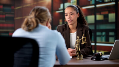 Attorney Consoles Her Upset Hispanic Client After Hearing.